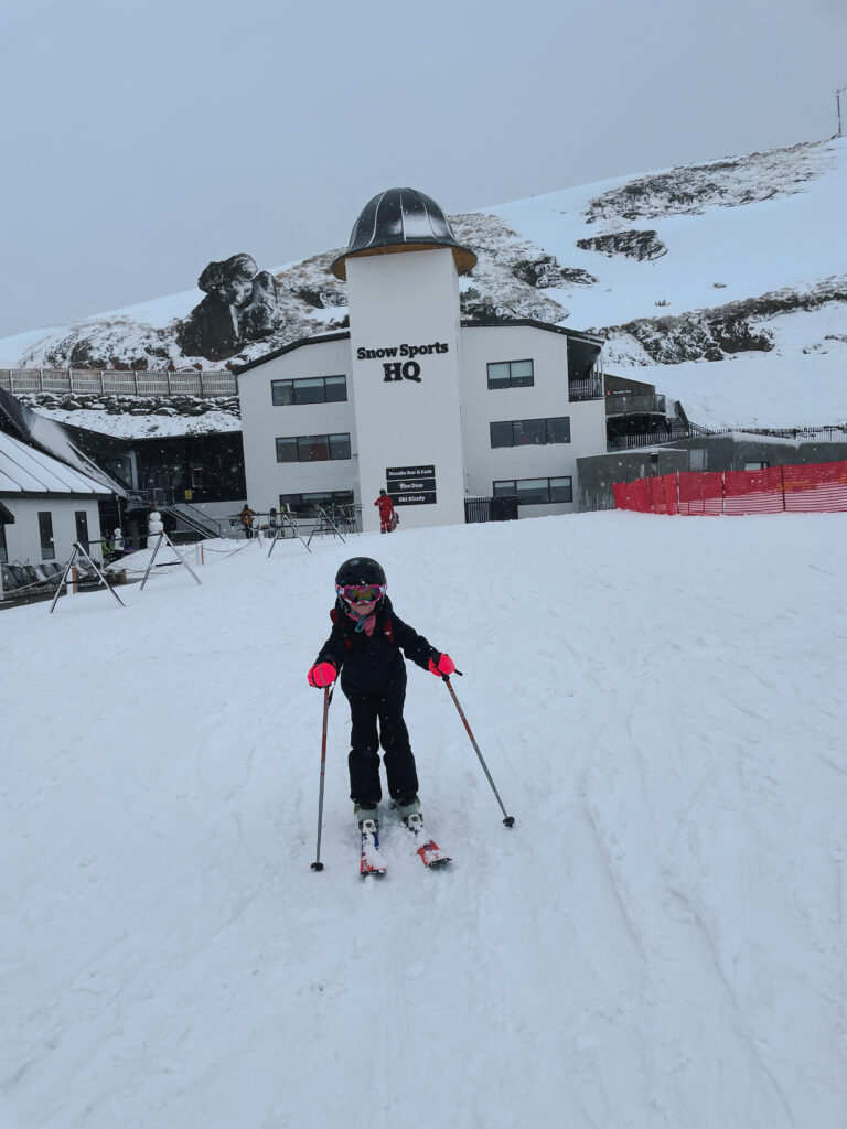 little girl having fun skiing in New Zealand