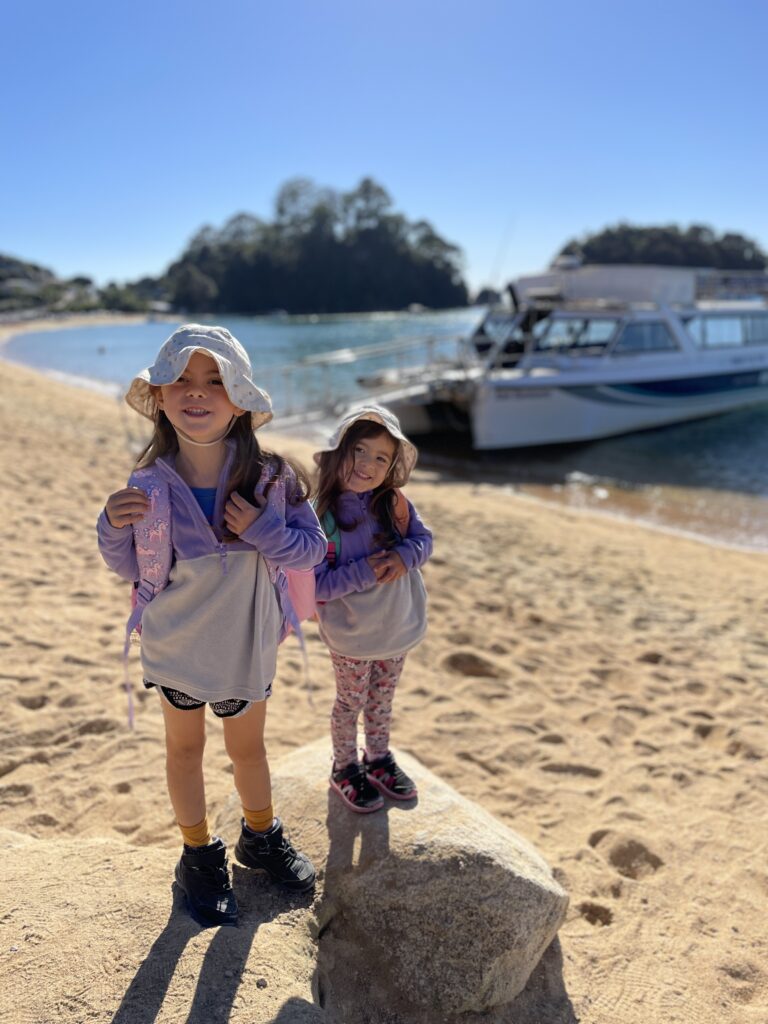 2 small children staying in front of the Abel Tasman Water Taxi
