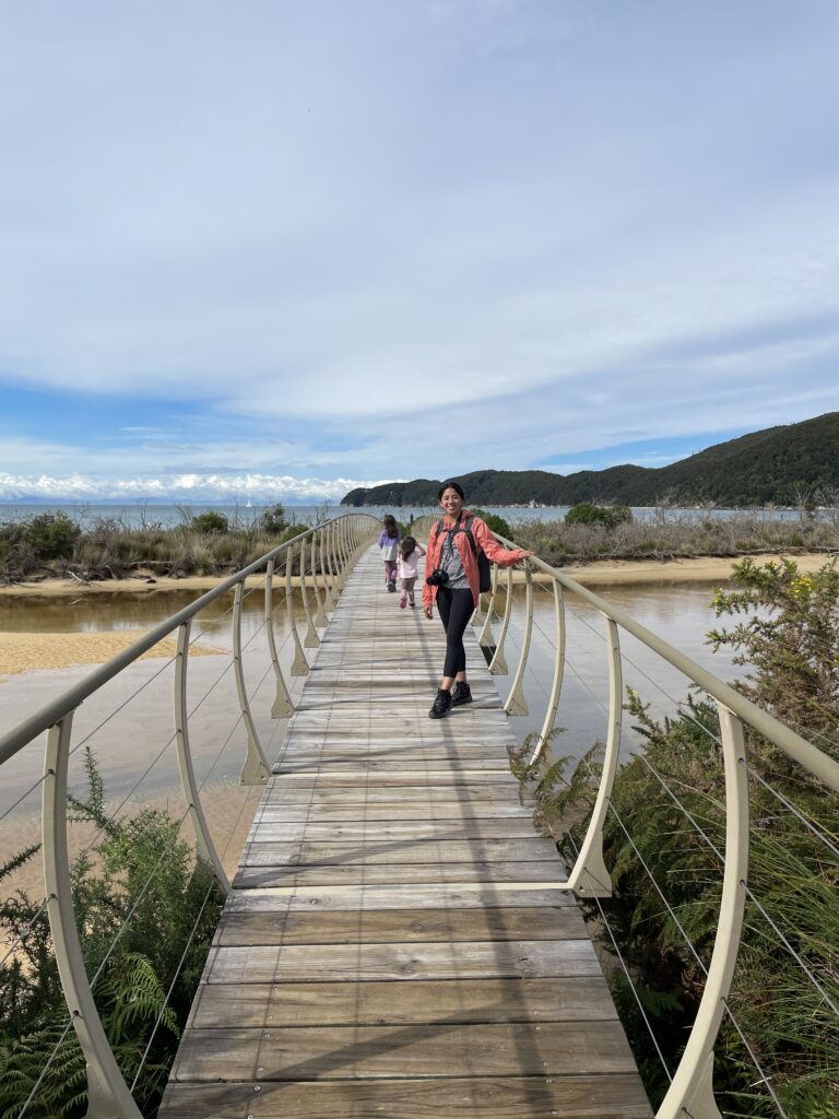 woman on a bridge on Abel Tasman hike 