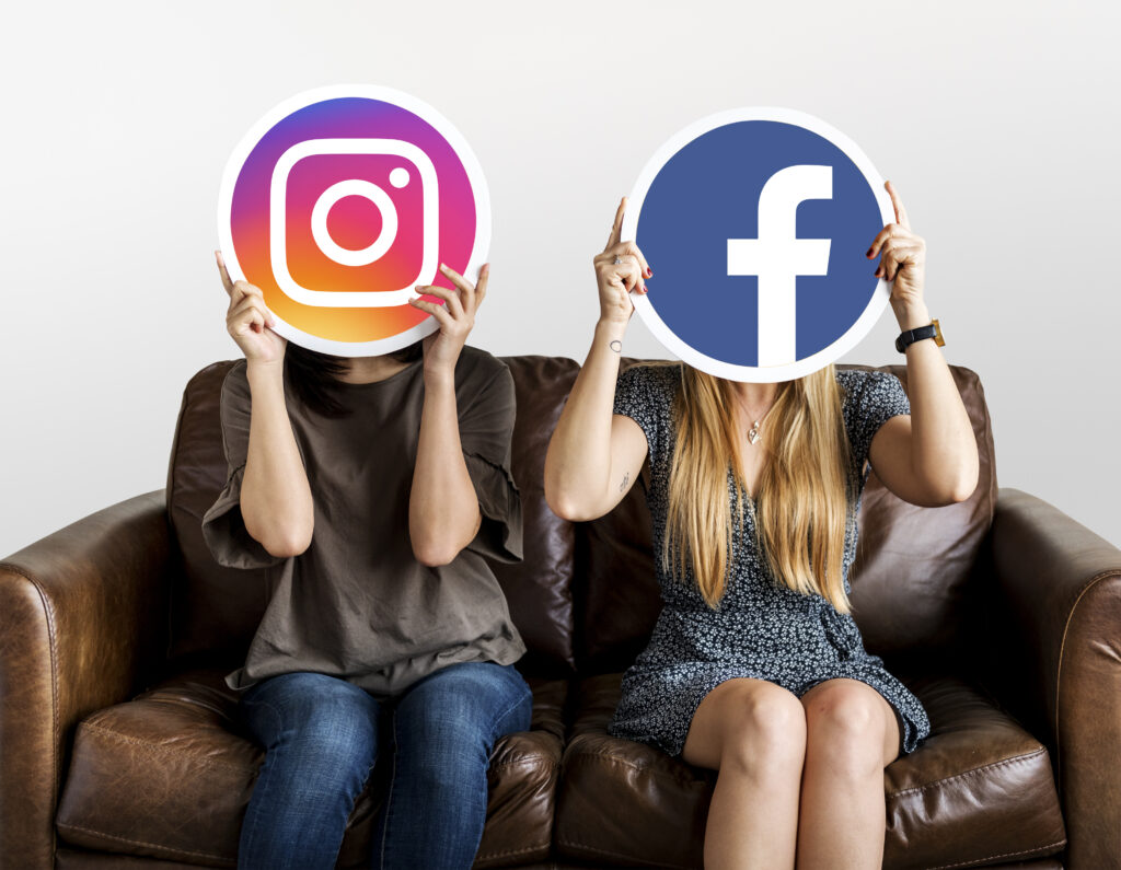 two women sitting on couch with Facebook and Instagram logo covering their faces