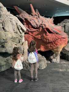 2 girls wearing kids travel entertainment bag