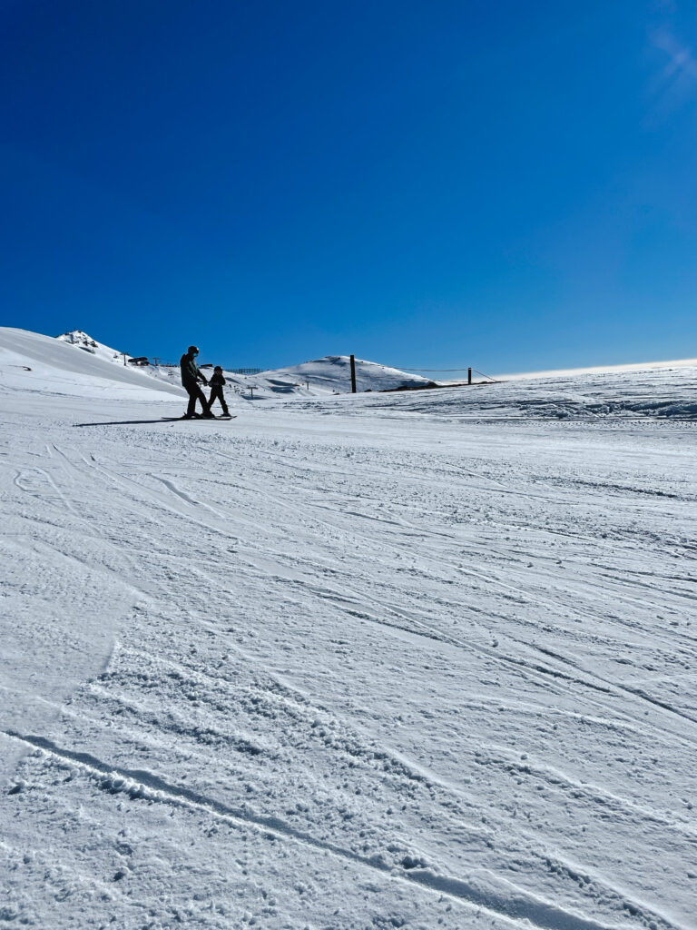 father and daughter skiing at family friendly ski resort in New Zealand